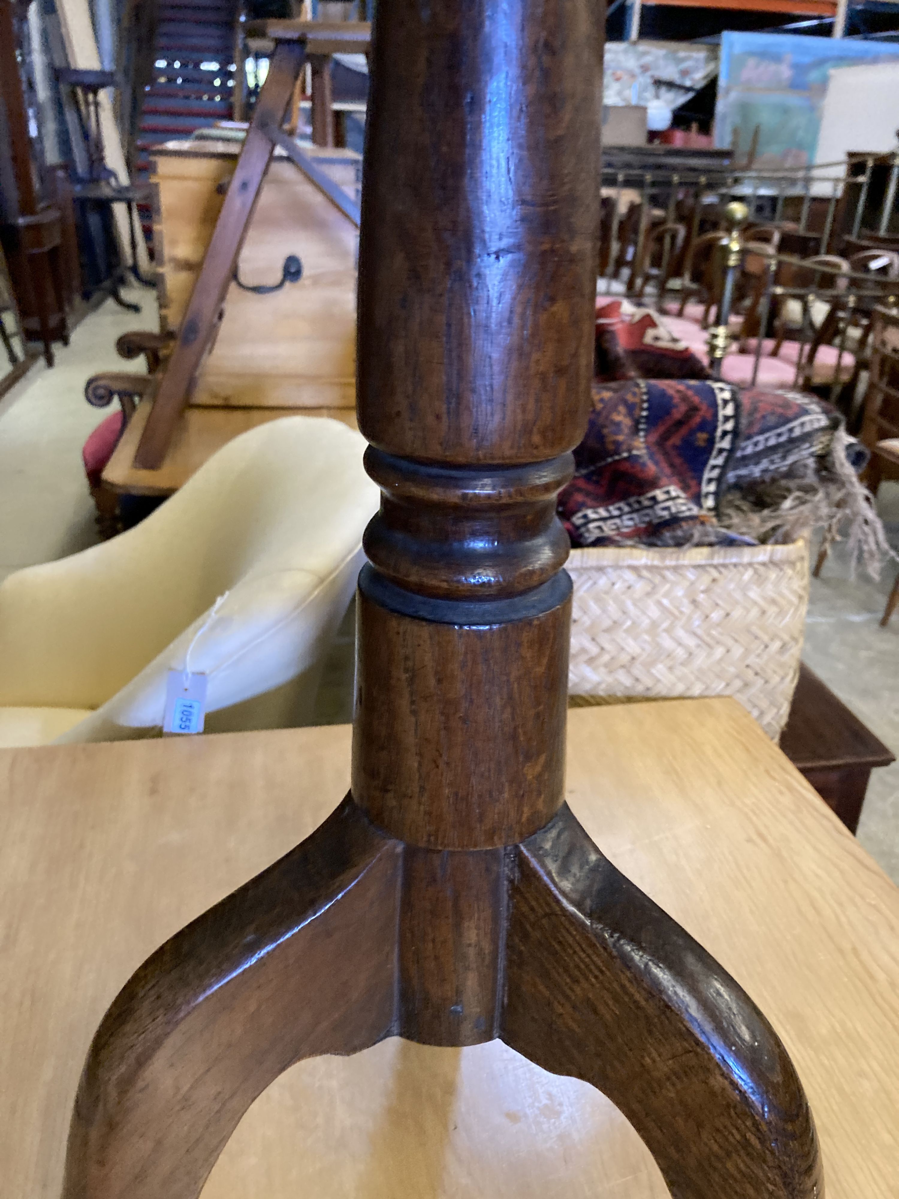 A George III circular oak tea table on tripod base, height 68cm, 78cm diameter